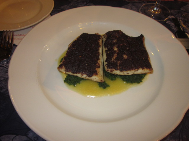 Gratineed sea bass with olive puree...interesting concept