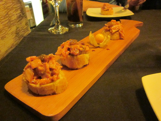 Amazing (and creative!) bruschetta from Uchu: made with caramelized tomatoes, smoked bacon, tamarind, and aguaymanto (a local Peruvian berry)