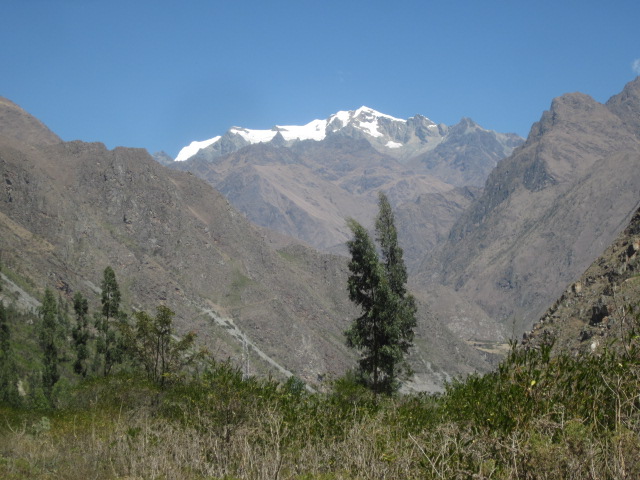Morning trek alongside snow-capped mountains