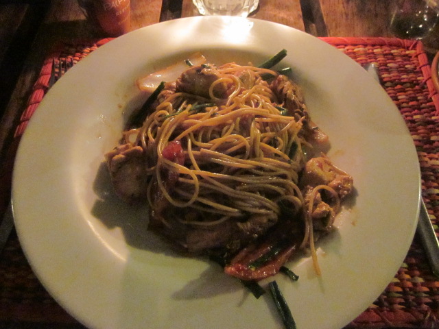 Tallarin de saltado de pollo - chicken stir-fried with pasta, tomatoes, and onions in a soy sauce