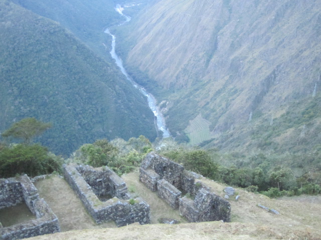 Some ancient houses at Winay Wayna.  You can see our campsite across the valley but it's still another hour's walk away.  