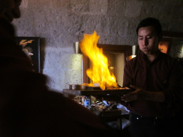 My assortment of fish (salmon, tuna, paiche -- Amazonian fish) served flambeed with pisco.  No smoke detectors here!
